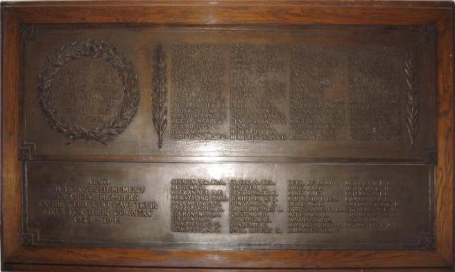 Photo of the War Memorial, an iron plaque with names of people who served in both world wars