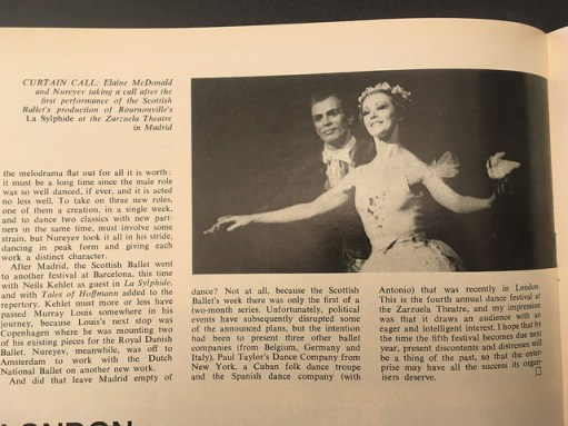 A black and white photograph in Dance and Dancers magazine showing Rudolf Nureyev behind Elaine McDonald, both with arms outstretched as they take a curtain call after their performance together